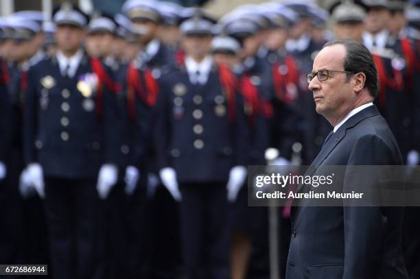 French President Francois Hollande attends the National tribute to fallen French Policeman Xavier Jugele on April 25, 2017 in Paris, France. French...