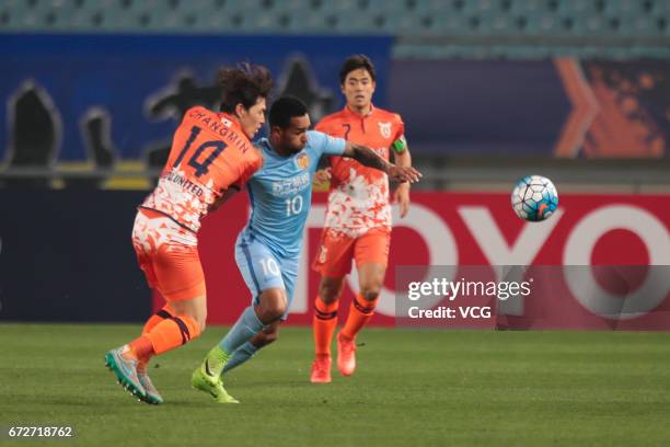 Alex Teixeira of Jiangsu Suning and Lee Chang-min of Jeju United vie for the ball during 2017 AFC Champions League group match between Jiangsu Suning...