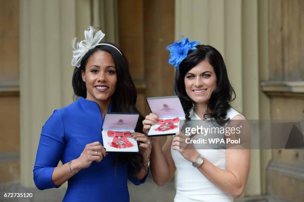 Alexandra Scott and Karen Carney after they were awarded MBEs for services to football by the Princess Royal during an Investiture ceremony at...