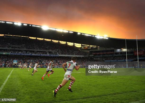 The Dragons kick off after half time at sunset during the round eight NRL match between the Sydney Roosters and the St George Illawarra Dragons at...