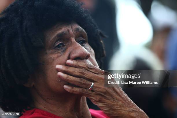 Indigenous woman looks on during the ANZAC service at Redfern Park on April 25, 2017 in Sydney, Australia. The annual ANZAC coloured diggers event...