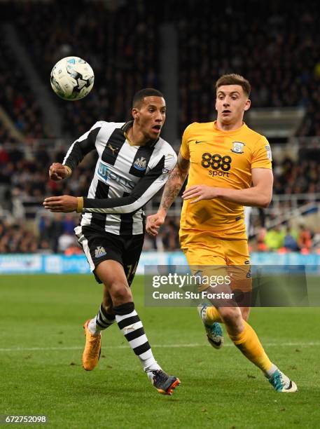 Newcastle player Isaac Hayden is challenged by Jordan Hugill of Preston during the Sky Bet Championship match between Newcastle United and Preston...