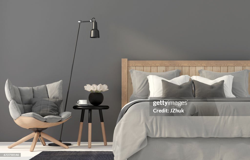 Gray bedroom with a wooden bed