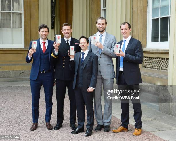 Matthew Gotrel, Lieutenant Peter Reed, Phelan Hill, Paul Bennet and Scott Durant, pose after being awarded MBEs for services to rowing by the...