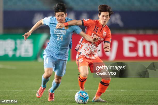 Ji Xiang of Jiangsu Suning and Lee Chang-min of Jeju United vie for the ball during 2017 AFC Champions League group match between Jiangsu Suning F.C....