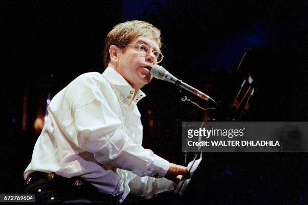 British singer and musician Elton John performs on stage on December 6, 1993 in Sun City.
