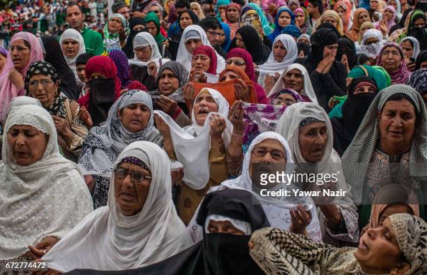 Kashmiri Muslim women pray as a head priest displays the holy relic believed to be the whisker from the beard of the Prophet Mohammed on the occasion...