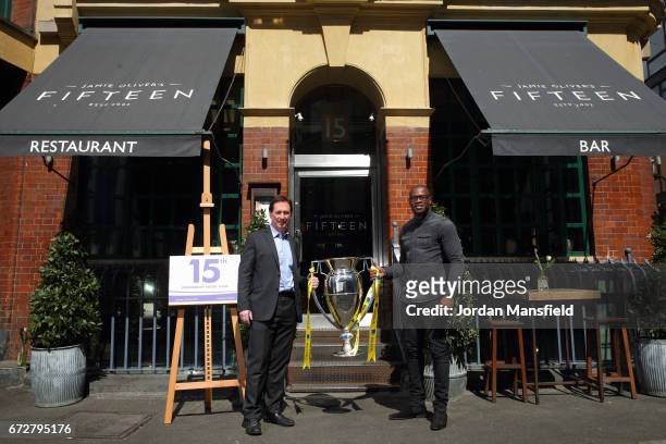 Ugo Monye and Mark McCafferty pose for a photo with the Premiership Trophy during the Media Lunch to celebrate the 15th Premiership Rugby Final With...