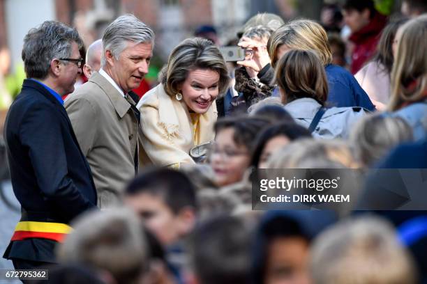 Kruibeke's mayor Jos Stassen , Queen Mathilde of Belgium and King Philippe - Filip of Belgium greet people as they visit the Wissekerke Castle,...
