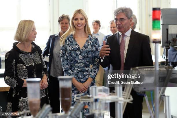 Ivanka Trump, daughter of U.S. President Donald Trump, , CEO Siemens Joe Kaeser and German Minister for Education Johanna Wanka look at a machine...