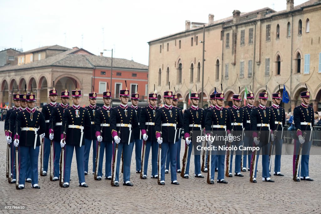 A group of military dress formal uniforms attend the visit...