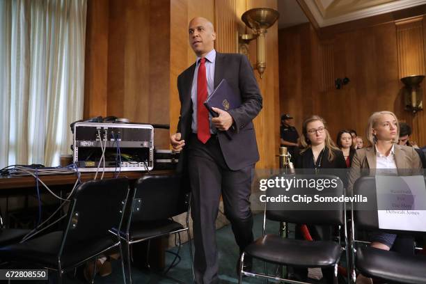 Senate Foreign Relations Committee member Sen. Cory Booker arrives for a committee hearing about Libya in the Dirksen Senate Office Building on...