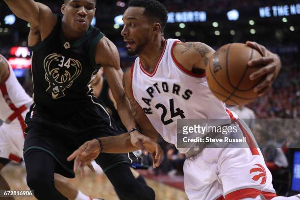 Toronto Raptors guard Norman Powell sprints past Milwaukee Bucks forward Giannis Antetokounmpo as the Toronto Raptors beat Milwaukee Bucks in game 5...