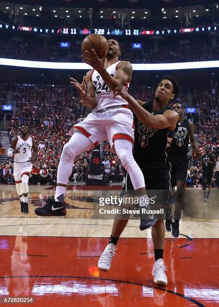 Toronto Raptors guard Norman Powell is fouled by Milwaukee Bucks guard Malcolm Brogdon as the Toronto Raptors beat Milwaukee Bucks in game 5 of their...