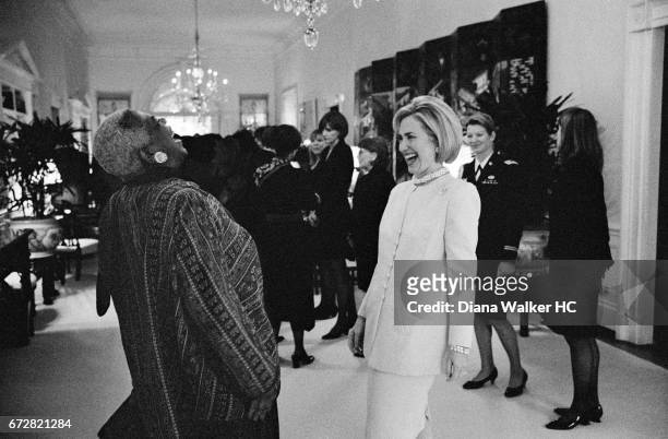 First Lady Hillary Rodham Clinton enjoys a laugh with Elaine Jones, president and director-counsel of the NAACP Legal Defense Fund, at a luncheon...