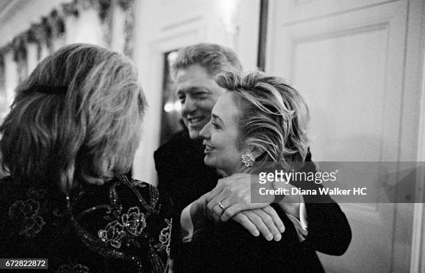 President William Clinton and First Lady Hillary Rodham Clinton are photographed with Eunice Shriver on their way to a dinner in the White House...