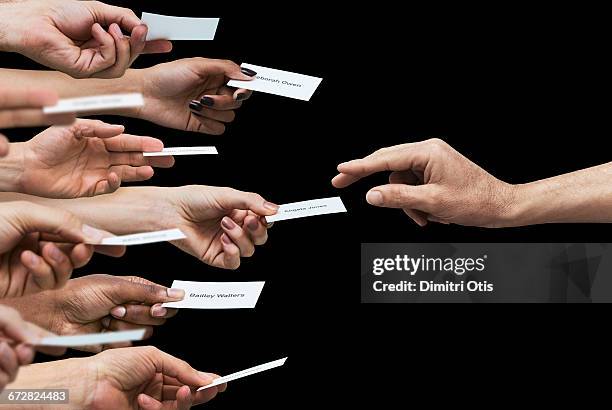 hand reaching for one of many business cards - business card stock pictures, royalty-free photos & images