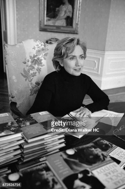 First Lady Hillary Rodham Clinton autographs her book 'Dear Socks, Dear Buddy: Kids' Letters to the First Pets', in the private dining room of the...