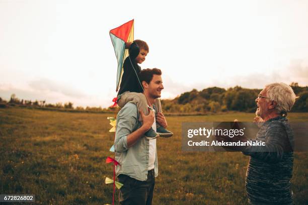 three generations of men - grandpa son stock pictures, royalty-free photos & images