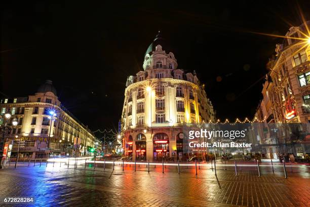 cafes and streets illuminated at night in lille - lille cafe stock pictures, royalty-free photos & images