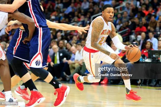 Kent Bazemore of the Atlanta Hawks drives to the basket during the fourth quarter against the Washington Wizards in Game Four of the Eastern...