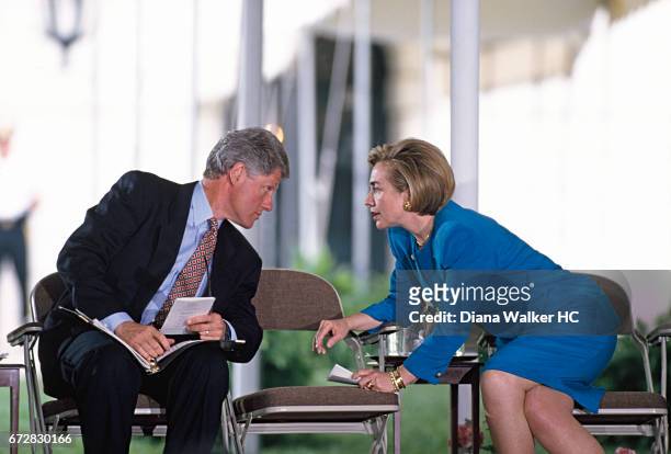 President William Clinton and First Lady Hillary Rodham Clinton compare notes prior to holding a historic meeting with hundreds of tribal leaders on...