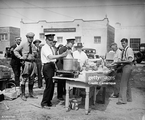 1930s MARCH 10 1933 EARTHQUAKE AFTERMATH GROUP OF PEOPLE WAITING IN FOOD LINES LONG BEACH CALIFORNIA USA