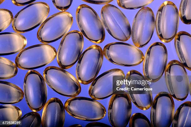 1990s OVERALL PATTERN OF TRANSLUCENT PILL CAPSULE LIKE VITAMIN E OR OMEGA 3 DRUGS