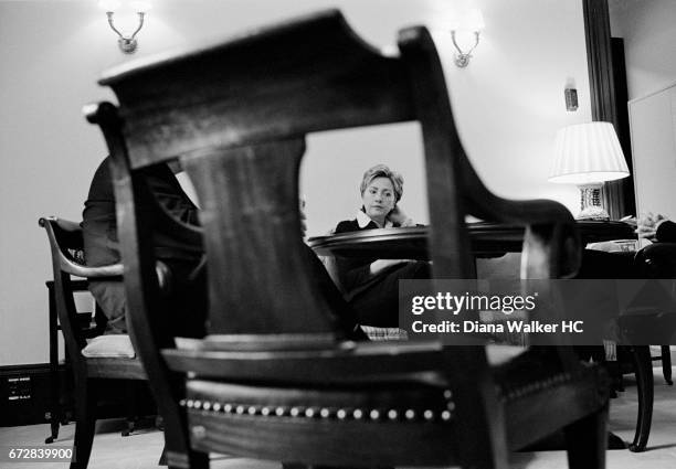 Senator Hillary Rodham Clinton chats with aides during an early morning meeting in her office in the Russell Senate Office Building on July 19, 2001...
