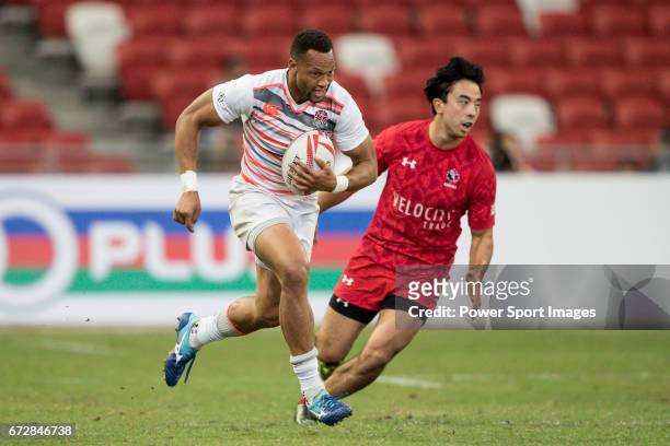 Dan Norton of England runs with the ball while Nathan Hirayama of Canada tries to stop him during the match Canada vs England, Day 2 of the HSBC...