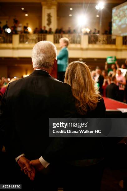 Former President William Clinton and daughter Chelsea Clinton are photographed looking on as Senator Hillary Rodham Clinton gives her victory speech...