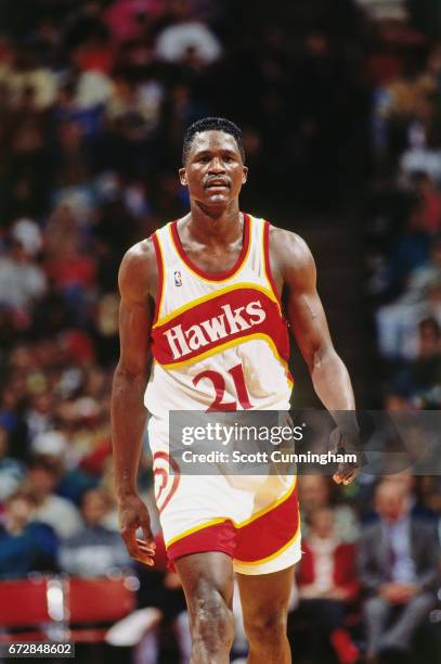 Dominique Wilkins of the Atlanta Hawks walks during a game played circa 1990 at the Omni in Atlanta, Georgia. NOTE TO USER: User expressly...