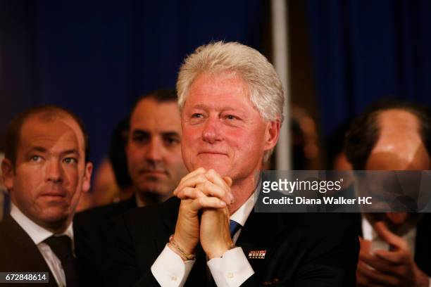 Former President William Clinton is photographed looking on as Senator Hillary Rodham Clinton gives her victory speech on April 22, 2008 at the Park...