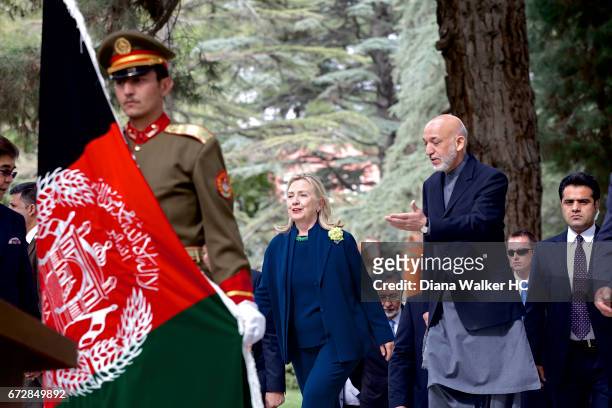 President Hamid Karzai of Afghanistan and Secretary of State Hillary Rodham Clinton walk to a joint press conference on October 20, 2011 in the...