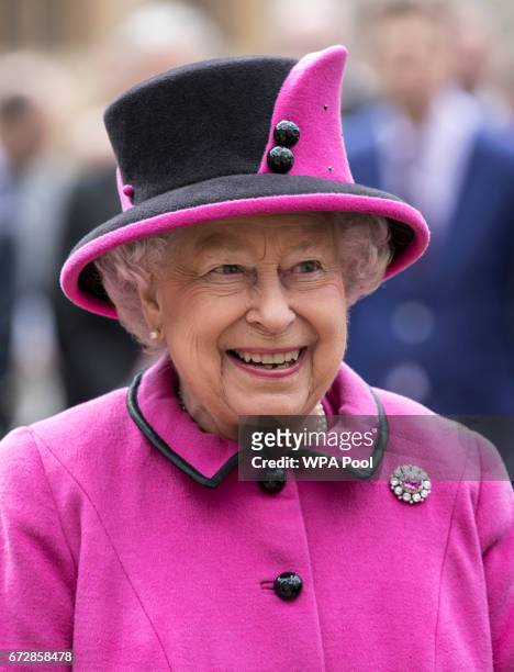 Queen Elizabeth II talks to recipients of new "Motability" vehicles during a ceremony on April 25, 2017 in Windsor, United Kingdom. Queen Elizabeth...