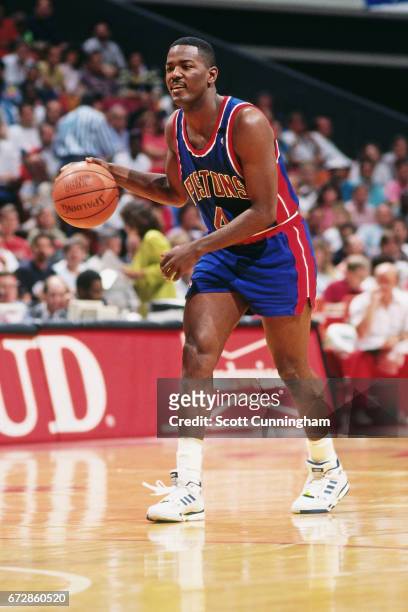 Joe Dumars of the Detroit Pistons dribbles against the Atlanta Hawks during a game played circa 1990 at the Omni in Atlanta, Georgia. NOTE TO USER:...