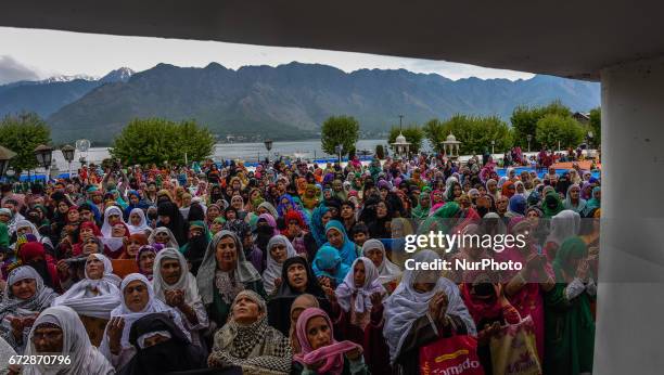 Kashmiri Muslim women pray as a head priest displays the holy relic believed to be the whisker from the beard of the Prophet Mohammed on the occasion...