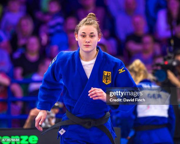 In a rematch of the u70kg individual final, Giovanna Scoccimarro of Germany runs onto the mat to confront European champion, Sanne Van Dijke but Van...