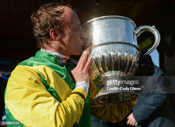 Kildare , Ireland - 25 April 2017; Jockey Robbie Power celebrates with the trophy after winning the BoyleSport Champion Steeplechase on Fox Norton at...