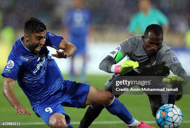 Kaveh Rezaei of Esteghlal and Majed Naser of Al Ahli in action during AFC Champions League match between Esteghlal vs Al Ahli FC at Azadi Stadium on...