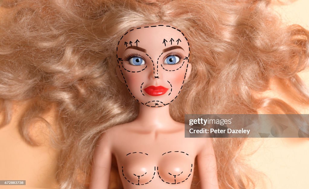 Doll marked up for plastic surgery