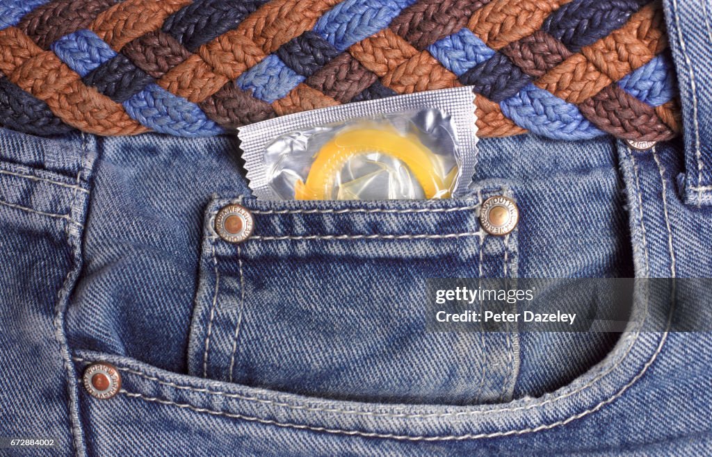 Condom in jeans pocket close up