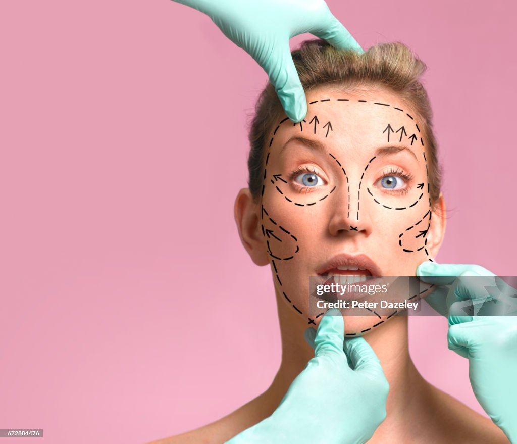 Plastic surgeon marking up for surgery