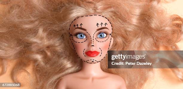 doll with face marked up for plastic surgery - barbie bildbanksfoton och bilder