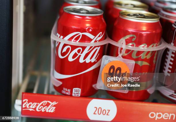 Coca Cola products are seen on a store shelf as the company announces plans to cut 1200 corporate staff jobs on April 25, 2017 in Miami, Florida. The...