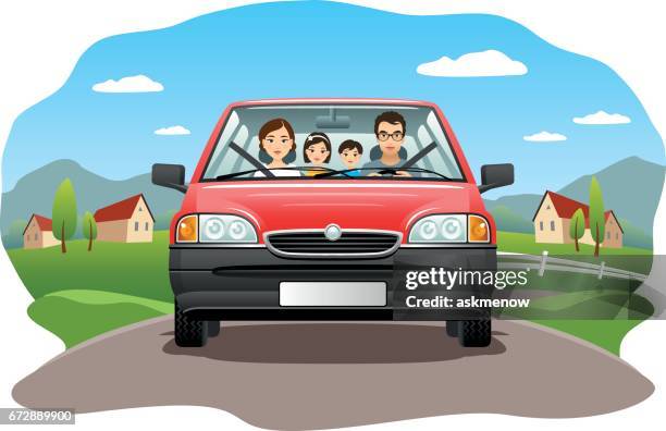 family in a car on a country road - road trip family stock illustrations