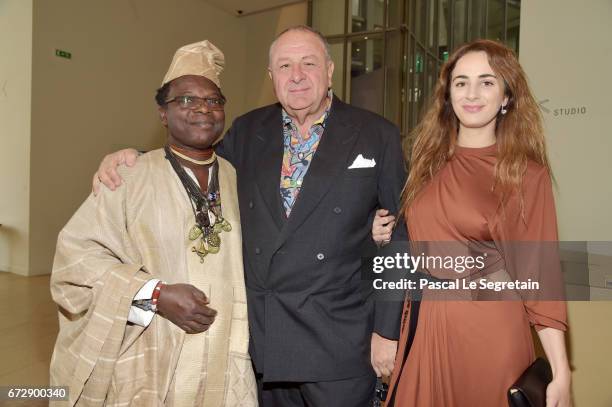 Artist Romuald Hazoume, Art Collector Jean Pigozzi and Alexia Niedzelski attend "Art Afrique, Le Nouvel Atelier" Exhibition Opening at Fondation...