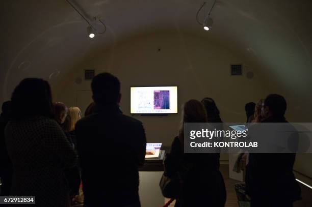 Tourists admire the Purple Codex or "Codex Purpureus", kept under a glass teapot in an air-conditioned multimedia room. In October 2015, it was...