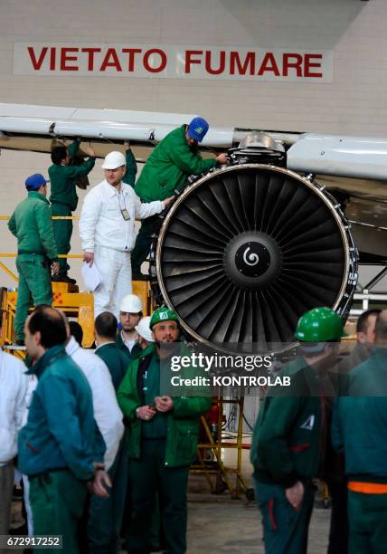 Atitech workers, work on a motor of one Alitalia airplane in Atitech Factory, in the airport of Capodichino in Naples.