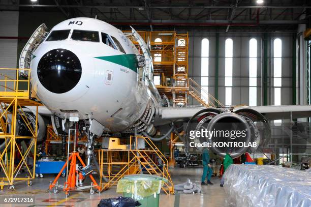 Atitech workers, work on Alitalia airplane in Atitech Factory, in the airport of Capodichino in Naples.